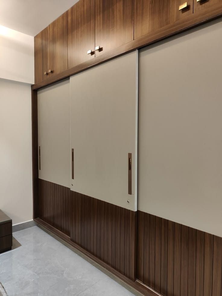 Minimal Sliding Wardrobe with Wooden Accents